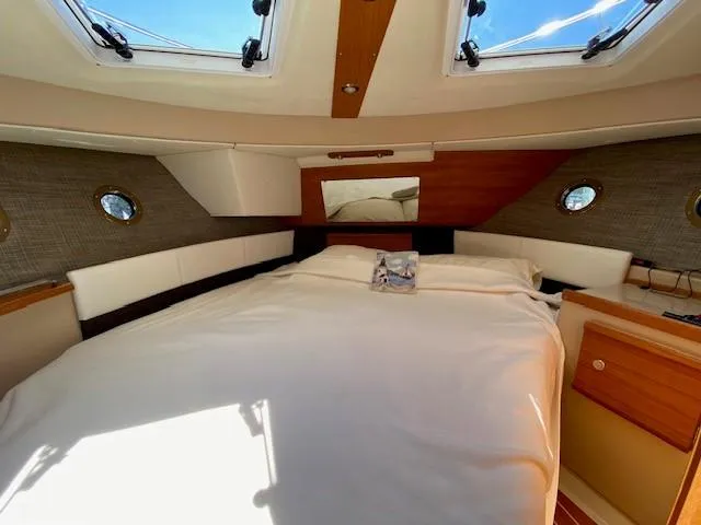 Windless Yacht Photos Pics Interior cabin of 2016 Ranger Tugs R-29 S Tug with skylights and cozy bed.