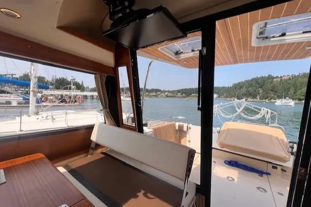 Windless Yacht Photos Pics Interior view of 2016 Ranger Tugs R-29 S Tug with scenic water backdrop.