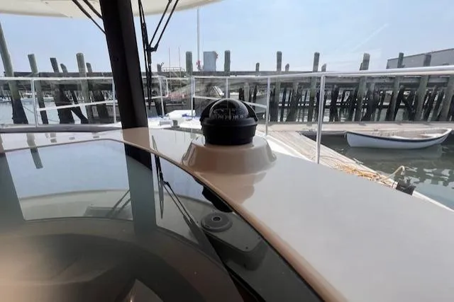Windless Yacht Photos Pics Interior view of 2016 Ranger Tugs R-29 S Tug with compass, dockside background.