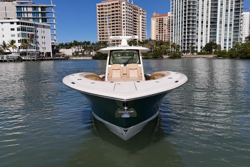 Perfect Season Yacht Photos Pics 2024 Scout 425 LXF boat on water with city skyline background.