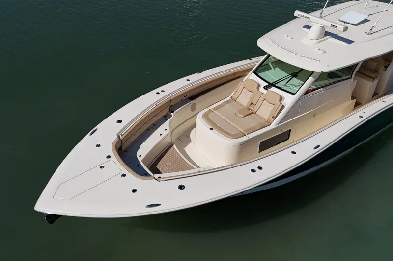 Perfect Season Yacht Photos Pics 2024 Scout 425 LXF luxury boat on calm water, showcasing sleek design and spacious deck.
