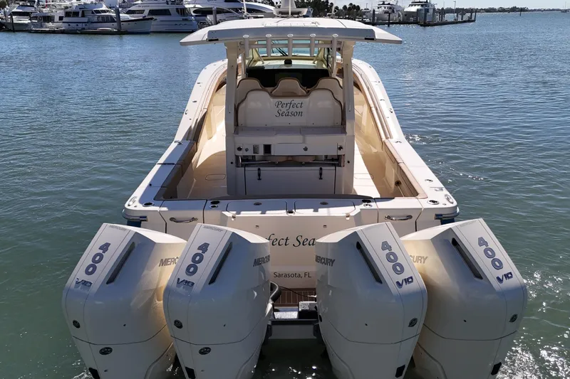 Perfect Season Yacht Photos Pics 2024 Scout 425 LXF boat with four Mercury 400 engines docked in marina.