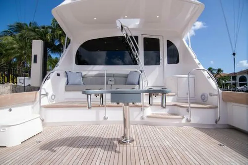 Caballo Grande Yacht Photos Pics 2024 Viking 68 Enclosed Bridge yacht with spacious deck and seating area.