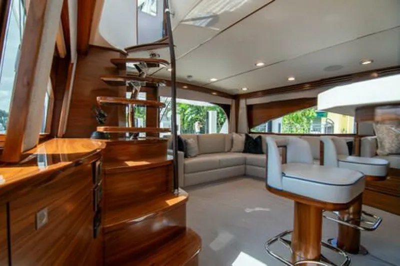 Caballo Grande Yacht Photos Pics Luxurious interior of 2024 Viking 68 Enclosed Bridge yacht with elegant wood finishes.