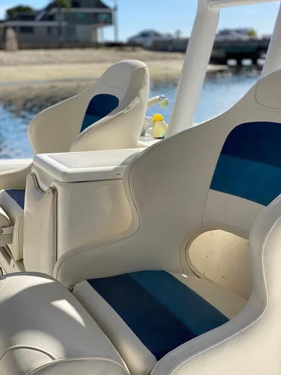 Stoked On Fishing Yacht Photos Pics 2008 Everglades 355 Center Console boat seats with blue accents, docked by the water.