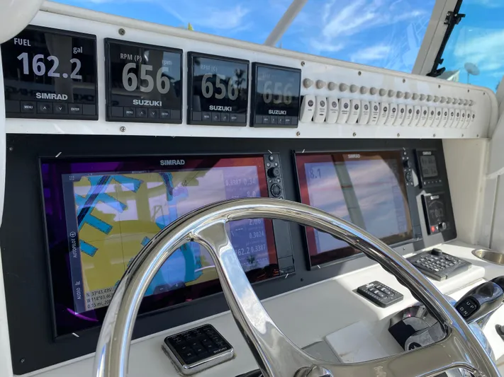 Stoked On Fishing Yacht Photos Pics Dashboard of 2008 Everglades 355 Center Console with navigation and engine displays.