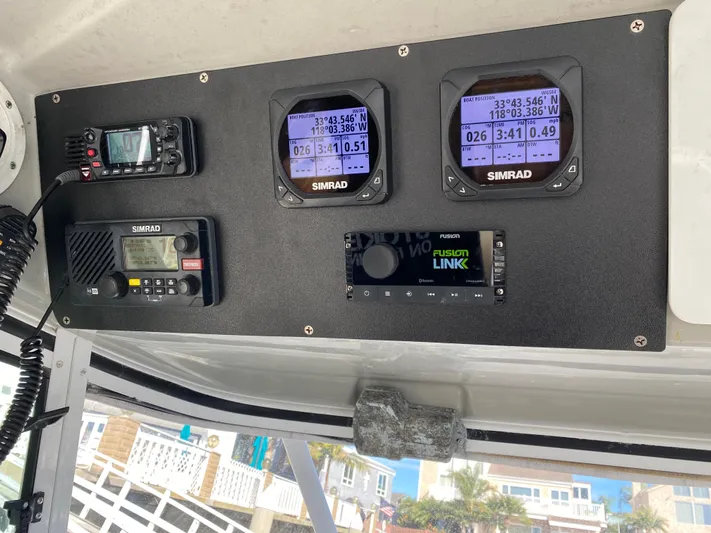 Stoked On Fishing Yacht Photos Pics Control panel of a 2008 Everglades 355 Center Console with Simrad navigation equipment.