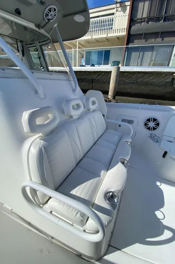 Stoked On Fishing Yacht Photos Pics 2008 Everglades 355 Center Console boat with white seating and cup holders.