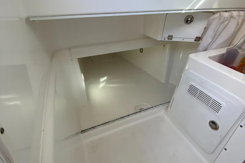 Stoked On Fishing Yacht Photos Pics Interior cabin of 2008 Everglades 355 Center Console boat, featuring storage and white finish.