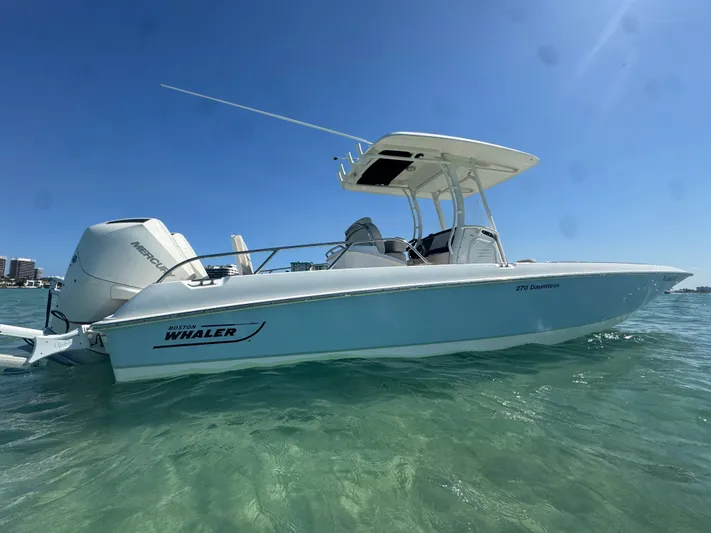  Yacht Photos Pics 2020 Boston Whaler 270 Dauntless boat on clear water under blue sky.