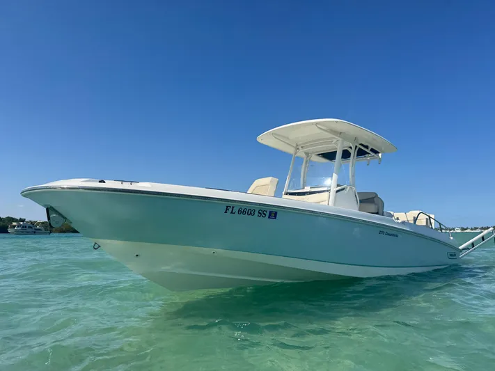  Yacht Photos Pics 2020 Boston Whaler 270 Dauntless boat on clear water under blue sky.