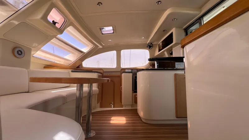 1687 Yacht Photos Pics Interior of a 2006 Leopard 40 catamaran with modern design and wooden accents.