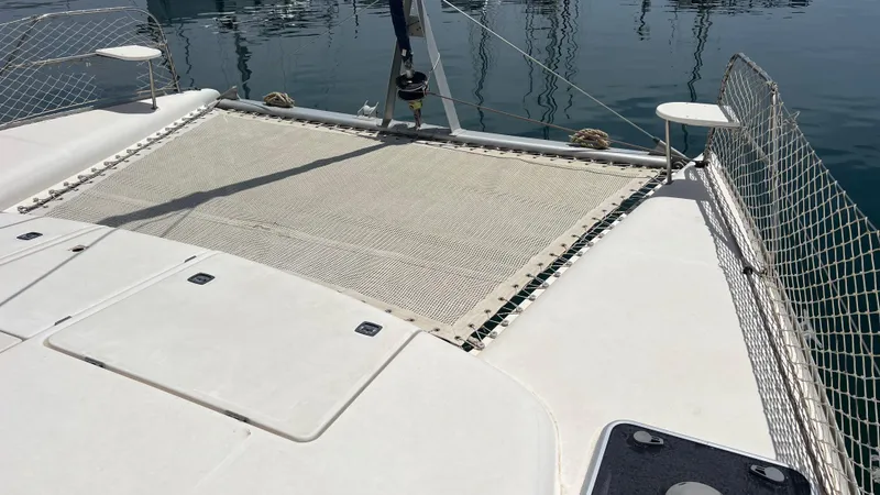 1687 Yacht Photos Pics Leopard 40 catamaran deck with netting, 2006 model, on calm water.