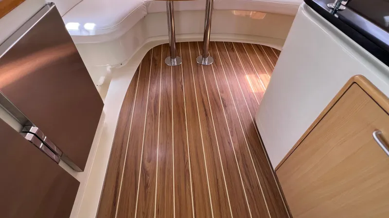 1687 Yacht Photos Pics Interior of 2006 Leopard 40 yacht with wood flooring and modern kitchen.