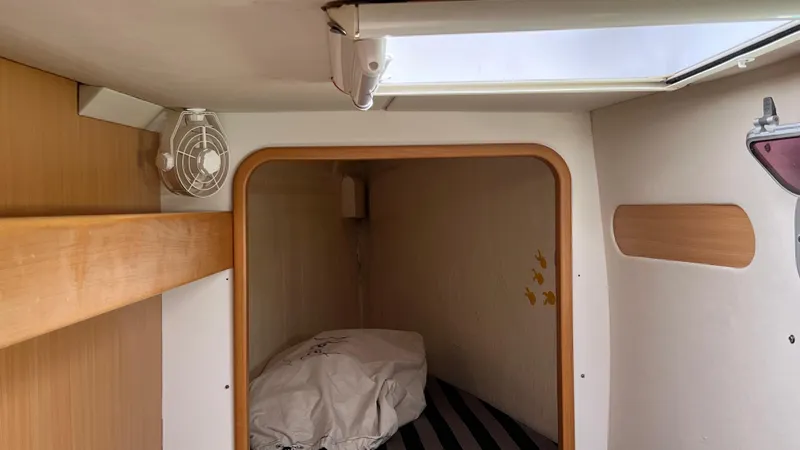 1687 Yacht Photos Pics Cozy cabin interior of a 2006 Leopard 40 catamaran with a small bed and skylight.