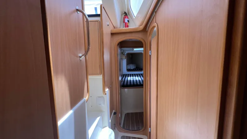 1687 Yacht Photos Pics Interior of 2006 Leopard 40 yacht with wooden cabinetry and compact design.
