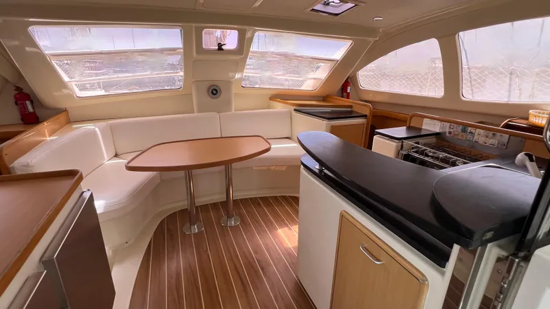 1687 Yacht Photos Pics Interior of 2006 Leopard 40 yacht with modern kitchen and seating area.