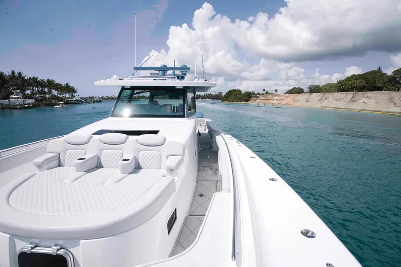 Bushwacked Yacht Photos Pics 2025 HCB 56 Suenos GIX luxury yacht cruising on clear blue waters.