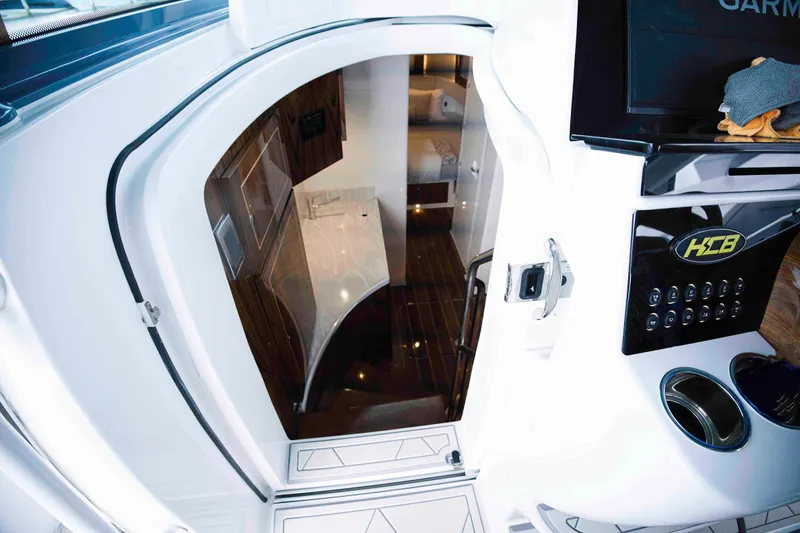 Bushwacked Yacht Photos Pics Interior view of 2025 HCB 56 Suenos GIX yacht, featuring sleek design and modern amenities.