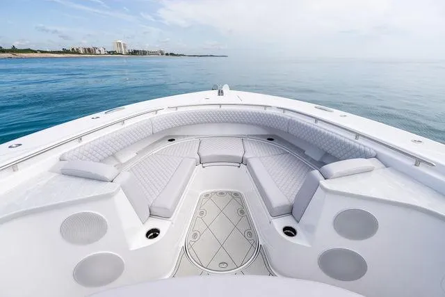Bushwacked Yacht Photos Pics Luxurious 2025 HCB 56 Suenos GIX yacht interior with elegant seating and ocean view.