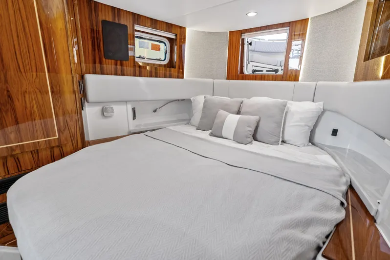 Bushwacked Yacht Photos Pics Luxurious cabin interior of 2025 HCB 56 Suenos GIX with elegant wood finish.