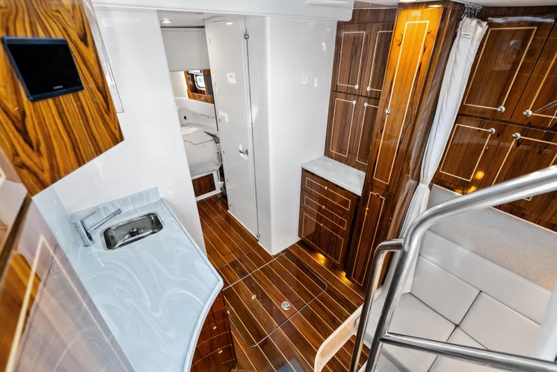 Bushwacked Yacht Photos Pics Luxurious interior of 2025 HCB 56 Suenos GIX yacht with wood finishes and modern amenities.