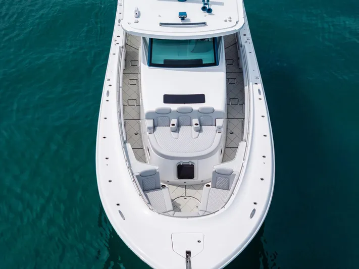 Bushwacked Yacht Photos Pics 2025 HCB 56 Suenos GIX luxury boat on clear blue water.