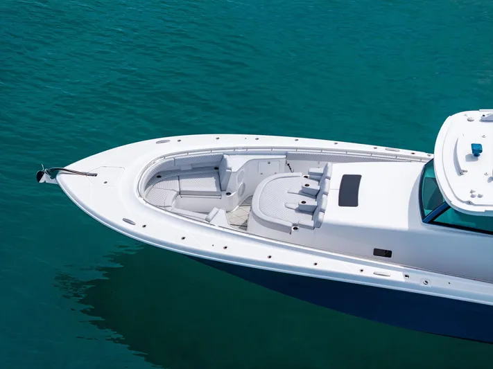 Bushwacked Yacht Photos Pics 2025 HCB 56 Suenos GIX luxury boat on clear blue water.