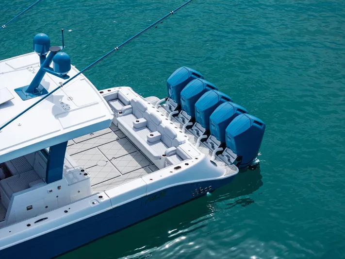 Bushwacked Yacht Photos Pics 2025 HCB 56 Suenos GIX luxury boat with four powerful outboard engines on clear water.