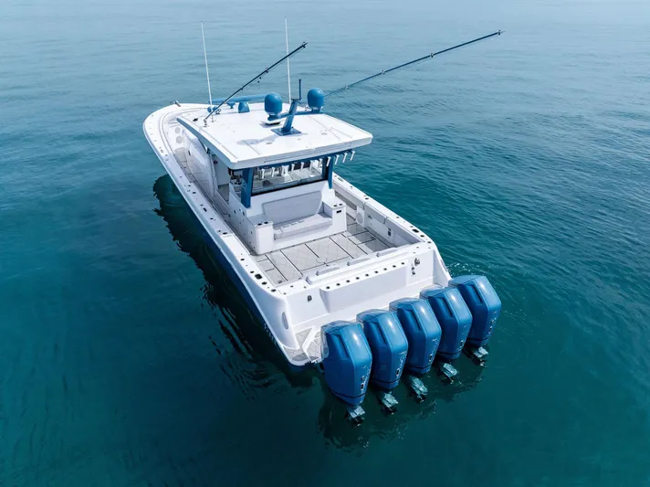 Bushwacked Yacht Photos Pics 2025 HCB 56 Suenos GIX boat with five engines on calm water.