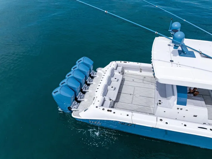 Bushwacked Yacht Photos Pics 2025 HCB 56 Suenos GIX boat with multiple outboard engines on open water.
