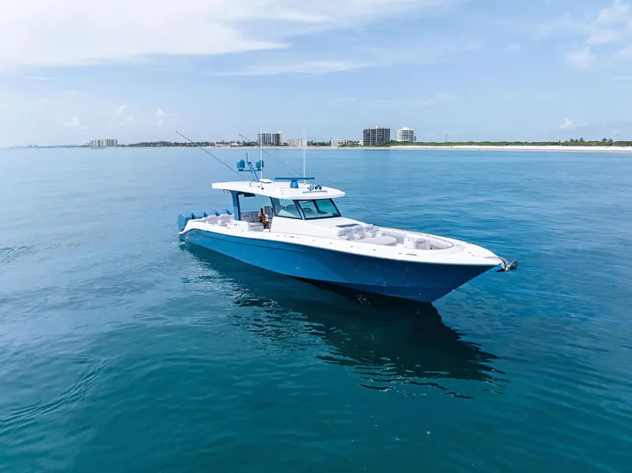 Bushwacked Yacht Photos Pics 2025 HCB 56 Suenos GIX luxury yacht cruising on calm blue waters.