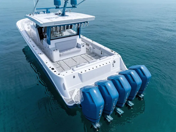 Bushwacked Yacht Photos Pics 2025 HCB 56 Suenos GIX boat with five powerful outboard engines on calm water.