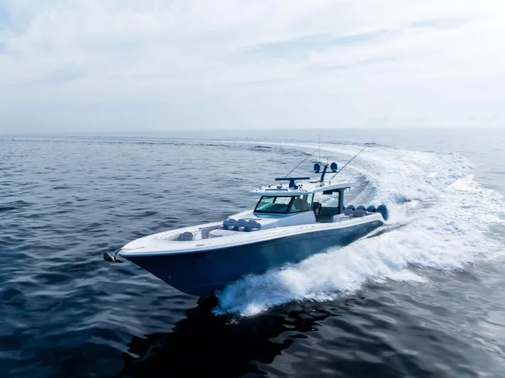 Bushwacked Yacht Photos Pics 2025 HCB 56 Suenos GIX cruising on open water, creating a dynamic wake.
