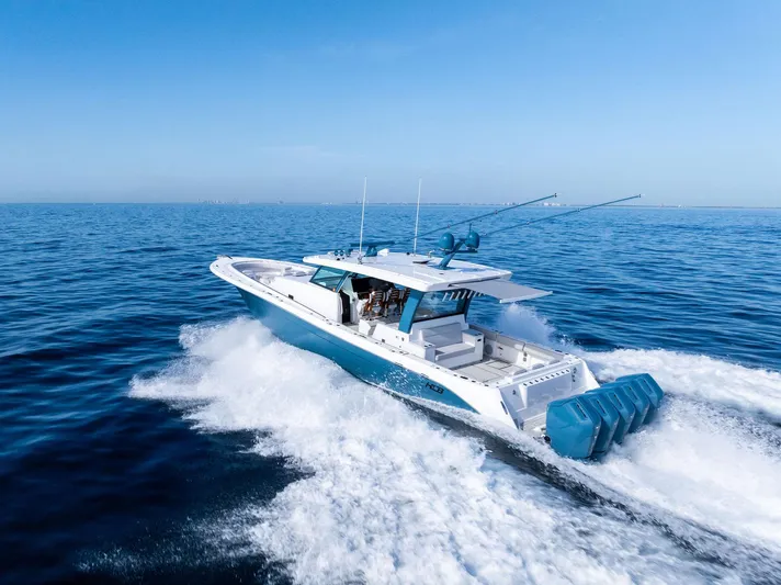 Bushwacked Yacht Photos Pics 2025 HCB 56 Suenos GIX cruising on open ocean, showcasing sleek design and powerful engines.