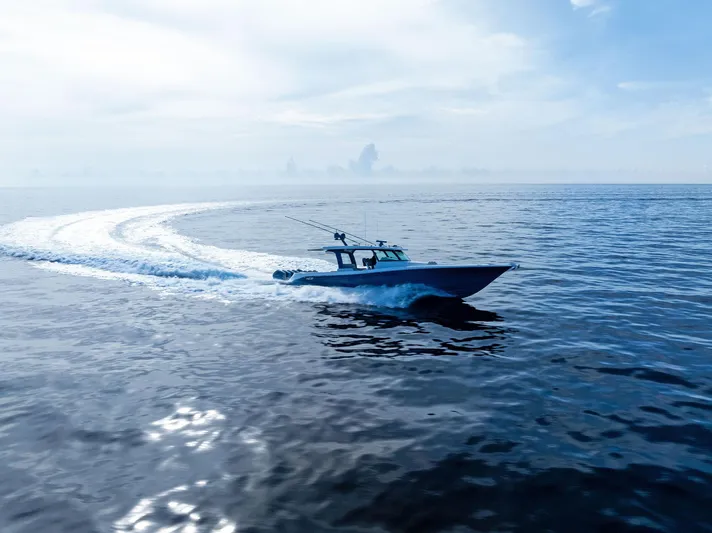 Bushwacked Yacht Photos Pics 2025 HCB 56 Suenos GIX cruising on open ocean under clear sky.