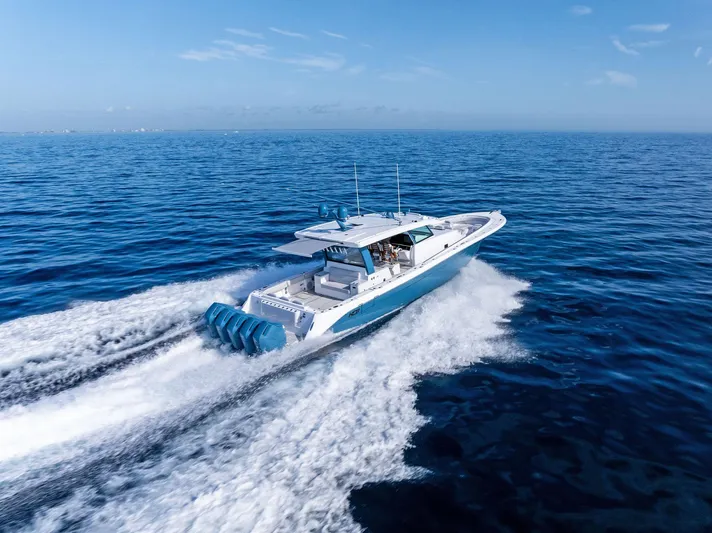 Bushwacked Yacht Photos Pics 2025 HCB 56 Suenos GIX cruising on open ocean, showcasing sleek design and powerful engines.
