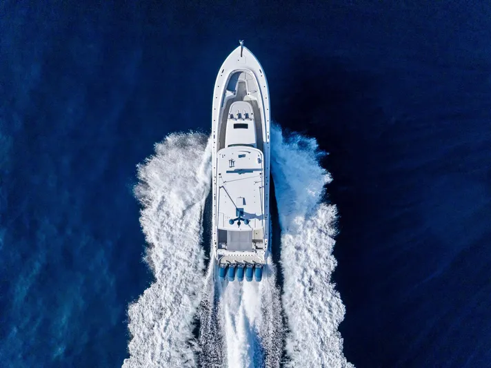 Bushwacked Yacht Photos Pics Aerial view of 2025 HCB 56 Suenos GIX yacht cruising on open water.