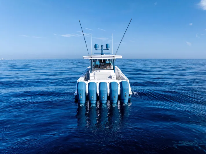Bushwacked Yacht Photos Pics HCB 56 Suenos GIX 2025 boat on open ocean, featuring multiple outboard engines.