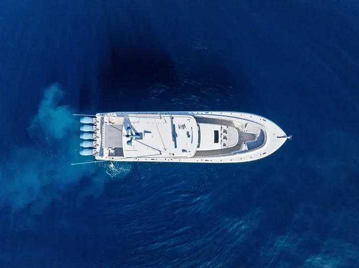 Bushwacked Yacht Photos Pics Aerial view of 2025 HCB 56 Suenos GIX yacht cruising in deep blue ocean.