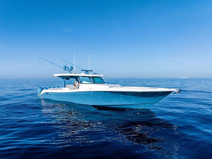 Bushwacked Yacht Photos Pics 2025 HCB 56 Suenos GIX boat on calm blue ocean under clear sky.