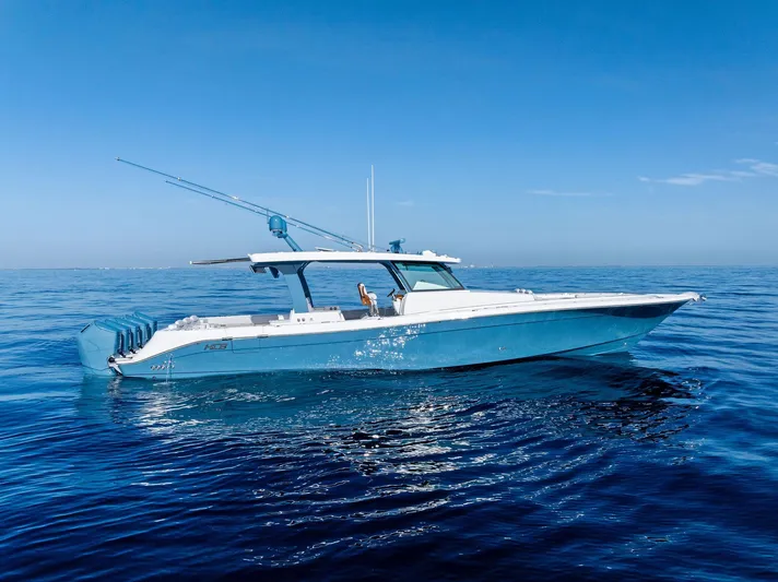 Bushwacked Yacht Photos Pics 2025 HCB 56 Suenos GIX luxury yacht cruising on calm blue ocean waters.