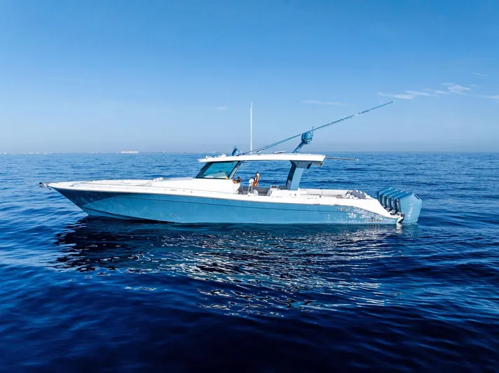 Bushwacked Yacht Photos Pics 2025 HCB 56 Suenos GIX luxury boat cruising on calm blue ocean waters.