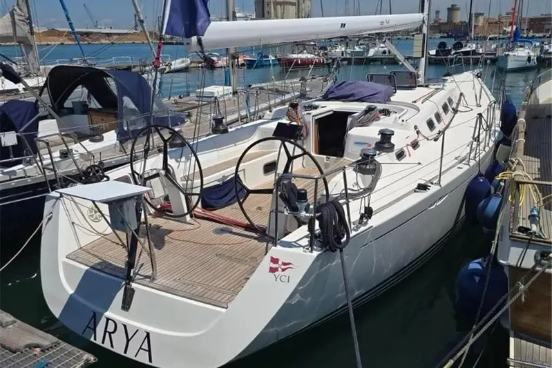 Arya Yacht Photos Pics 2010 X Yachts X-50 sailboat docked in marina, featuring dual steering wheels.