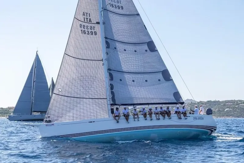 Arya Yacht Photos Pics 2010 X Yachts X-50 sailboat racing on open water with crew onboard.