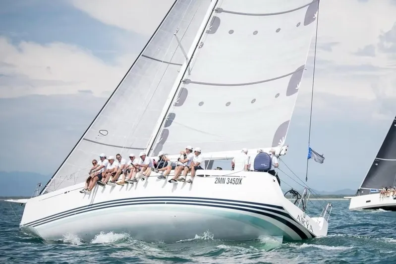 Arya Yacht Photos Pics Sailing yacht X Yachts X-50, 2010 model, with crew racing on open water.