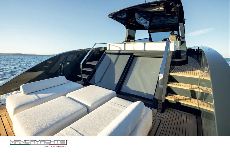  Yacht Photos Pics Luxurious 2025 MandaYachts S05 with sun loungers and sleek design on open water.