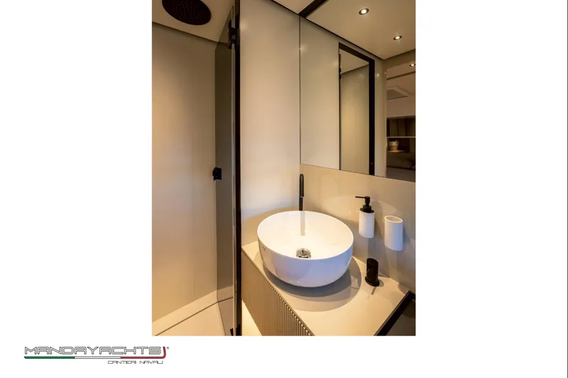  Yacht Photos Pics Modern bathroom interior on 2025 MandaYachts S05, featuring sleek sink and fixtures.