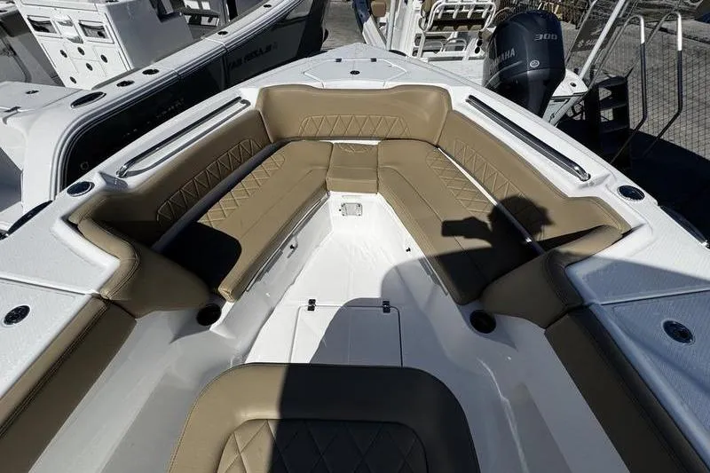  Yacht Photos Pics 2026 Blazer Bay Makaira 2800 boat interior with tan seating and white deck.