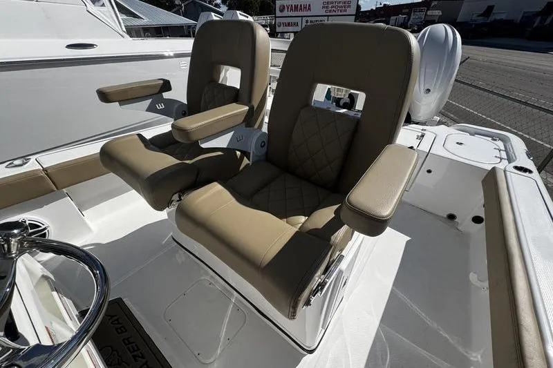 Yacht Photos Pics 2026 Blazer Bay Makaira 2800 boat seats with tan upholstery and armrests.